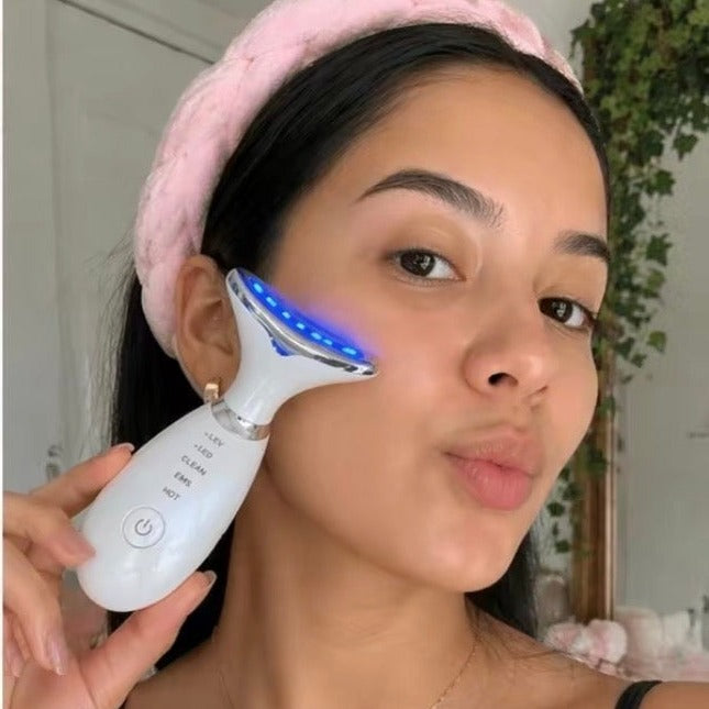 Customer using the LED wand in blue light mode on the cheek